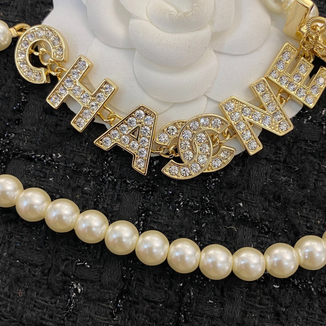 Ch**el Pearl And Crystal Logo Gold Tone For Women